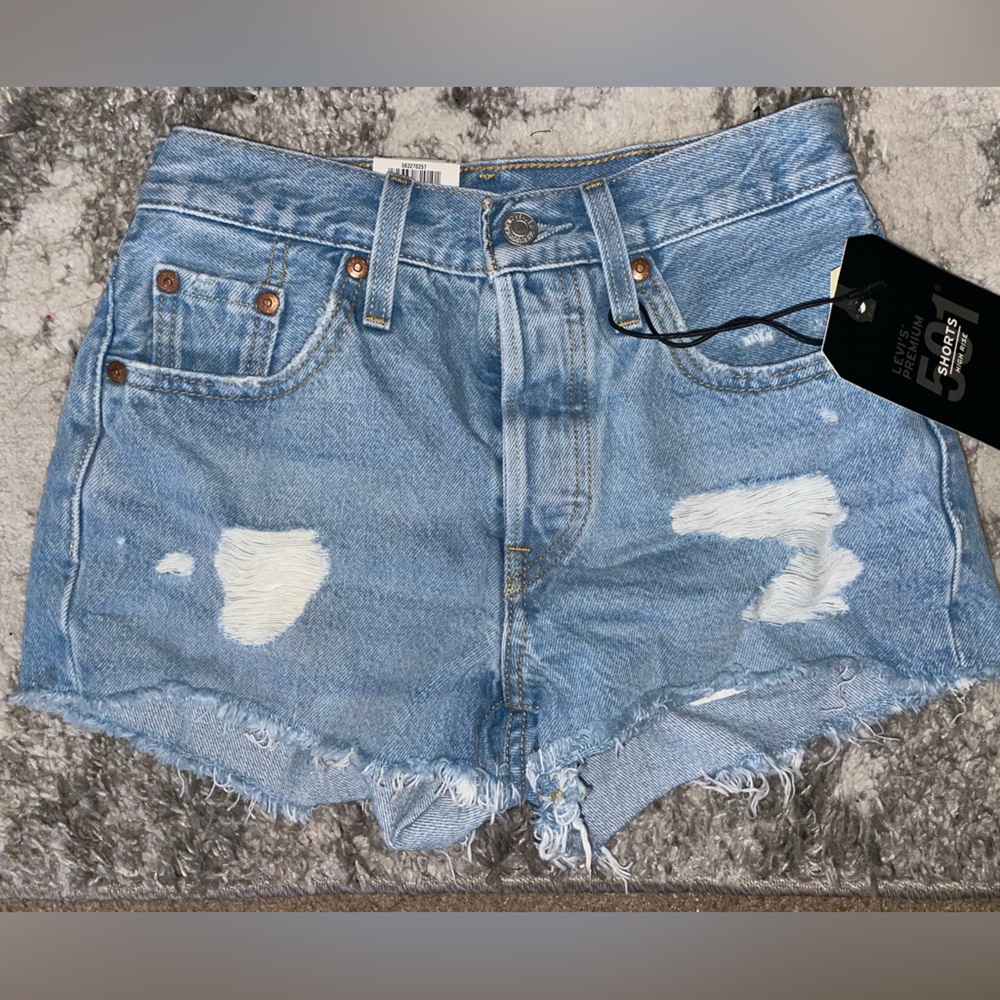 501 Levi’s High Waisted / High Rise Distressed Shorts in a Medium Light Wash